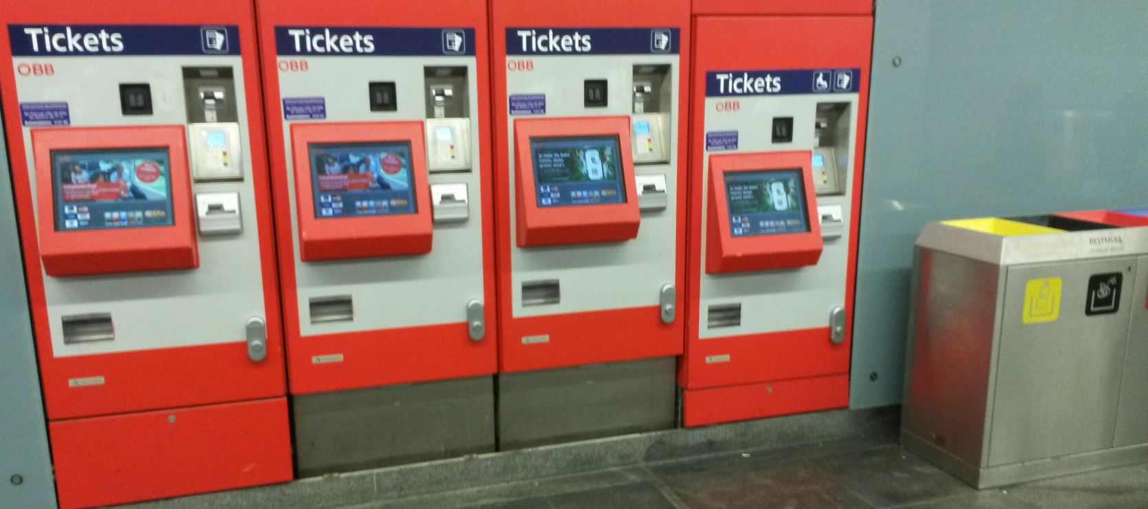 [Vienna]At the large Vienna Meidling station there are more than a dozen ticket machines (inevitable given the lack of a smartcard system). One of this bank of four machines is much lower  to be usable by wheelchair users. Whether it makes sense to put litter bin right next to it, making manoeuvrability less easy, is another matter